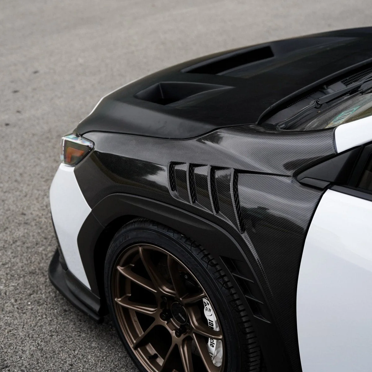 JDMuscle [22-25 WRX w/ FMIC] Carbon Fiber Scoopless Hood V1 - Image 5