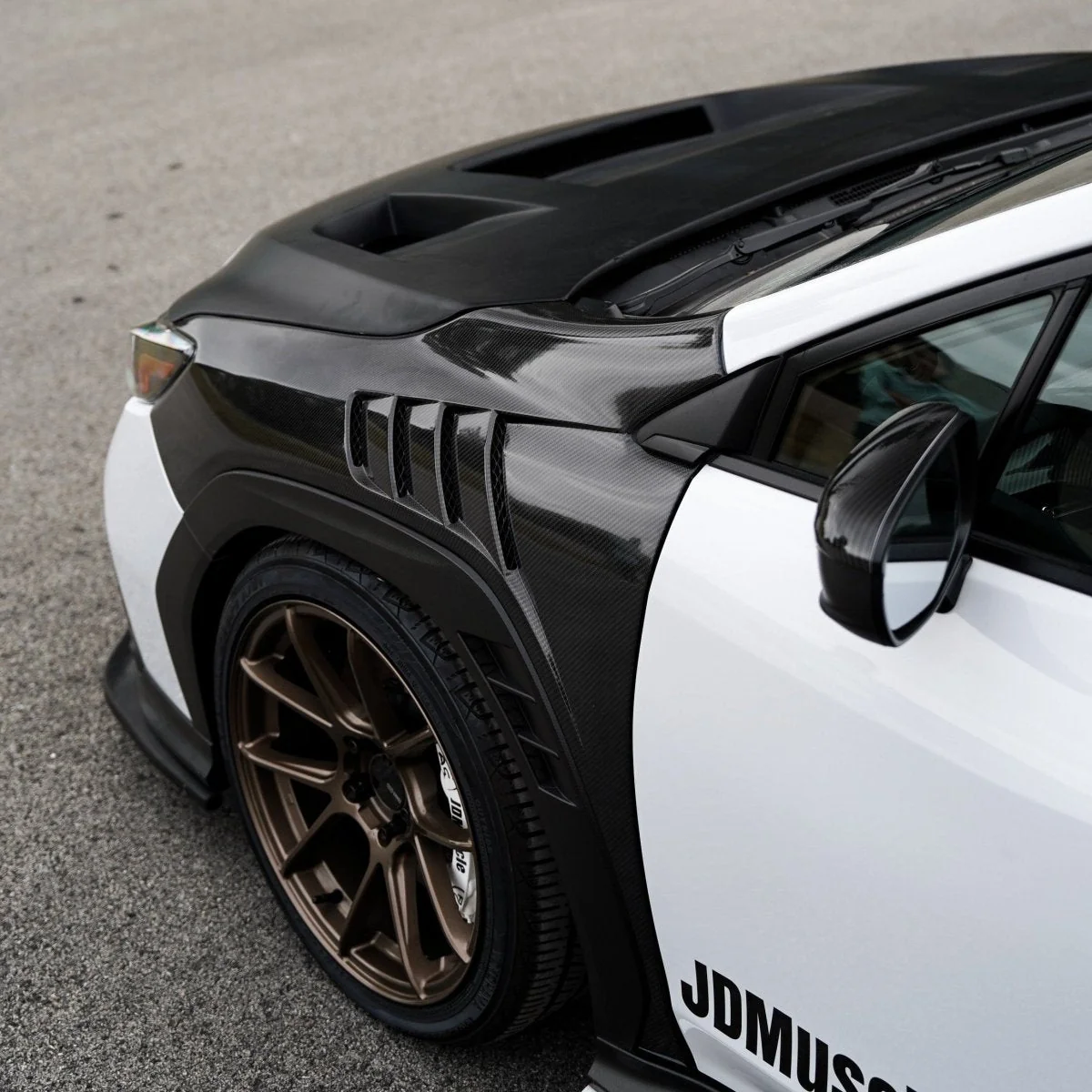 JDMuscle [22-25 WRX w/ FMIC] Carbon Fiber Scoopless Hood V1 - Image 7